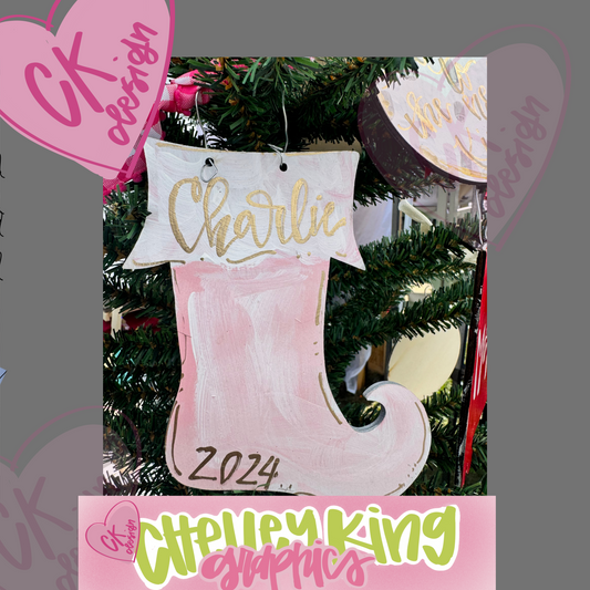 Adorable personalized hand painted wooden art ornament - Pink Christmas Stocking Approximately 6" ... Just let us know what you would like it to say, the color bow, and the color writing!:)

Would you like a custom color or design?&nbsp; Please reach out to me at chelley@chelleyking.com!